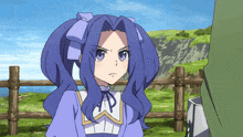 a girl with blue hair is standing next to a fence