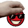 a hand is touching a red smiley face with sunglasses on .