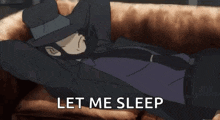 a man in a suit and hat is laying on a couch with his hands behind his head and the words `` let me sleep '' .