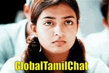 a girl is sitting in front of a sign that says globaltamilchat