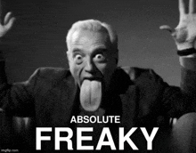 a black and white photo of a man sticking his tongue out with the words absolute freaky behind him
