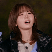 a close up of a woman making a funny face with her mouth open