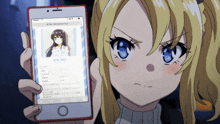 a blonde anime girl is holding a phone with a picture of a girl on it