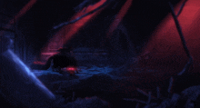 a dark room with a red light coming out of the ceiling