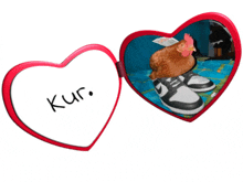 a heart shaped mirror with a picture of a chicken and the words kur written on it