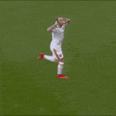 a soccer player with the number 7 on his shorts is hugging another player