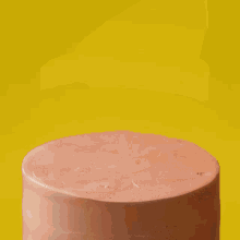a close up of a person cutting a piece of chocolate cake .