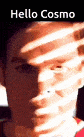 a close up of a man 's face with the words hello cosmo on the top