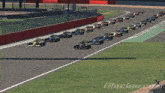 a row of racing cars are lined up on a race track with iracing.com at the bottom of the screen