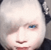 a girl with white hair and blue eyes is making a funny face .