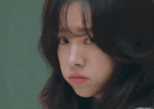 a close up of a woman 's face with her eyes closed