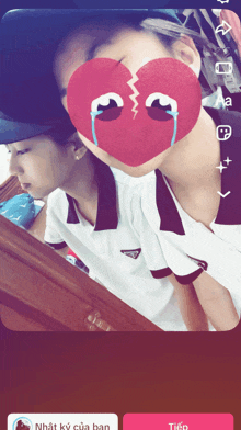 a person with a broken heart on their face and the word tiếp at the bottom