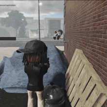 a screenshot of a video game shows a person standing next to a pile of blankets