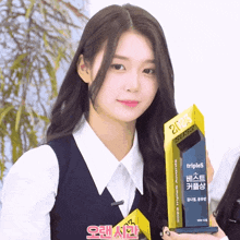 a girl is holding a trophy that says triples awards