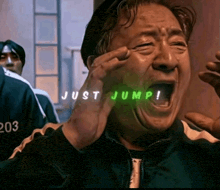 a man is crying with the words just jump written on his face