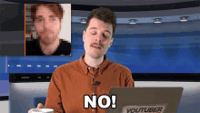 a man is sitting in front of a laptop that says youtuber on it