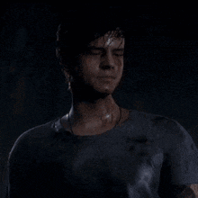 a man with blood on his face is standing in a dark room