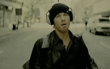 Guy-running Guy-wearing-headphones GIF - Guy-running Guy-wearing-headphones Band-jamiroquai GIFs