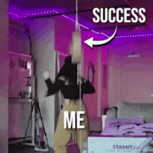 a woman is dancing in a room with purple lights and a sign that says success and me .