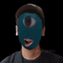 a man with a blue mask on his face and adnan jesko written on the bottom