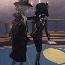 a woman in a witch hat is standing next to another woman