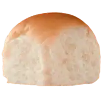 a close up of a loaf of bread on a white surface