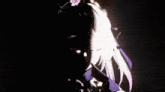 a girl with purple eyes and a flower in her hair