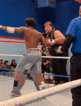 a man in a wrestling ring with the word cold on his pants