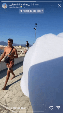 a picture of a man walking in viareggio italy is being shared on instagram