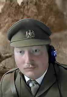 a man in a military uniform with a hat that has a lion on it