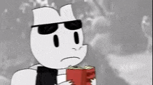 a cartoon character is wearing sunglasses and holding a book .