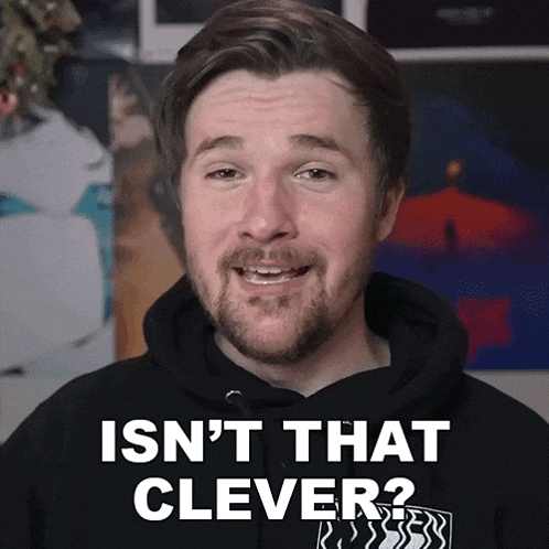 a man wearing a black hoodie says 