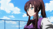 a girl with a ponytail is standing in front of a blue fence
