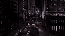 a busy city street at night with a sign that says ' a ' on it