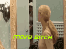 a woman is looking at herself in a mirror with the words move bitch written above her