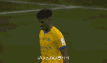 a soccer player wearing a yellow jersey with the number 70 on the back
