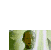 a man with a beard is wearing a white robe and a cross necklace .