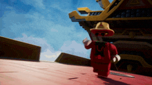a cartoon character in a red suit and hat is standing in front of a building