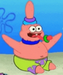 patrick star from spongebob squarepants is wearing a colorful hat and holding a lollipop in his mouth .