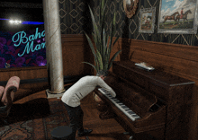 a man is playing a piano in front of a sign that says boho man