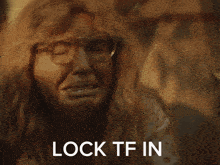 a blurry picture of a person with the words lock tf in above them