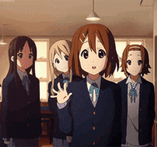 a group of anime girls are standing in a classroom and one of them is waving