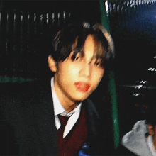 a blurry picture of a young man in a suit