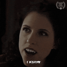a close up of a woman 's face with a laurel wreath behind her that says atlanta georgia film festival