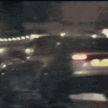 a blurry picture of a car with a license plate that says ' jc ' on it