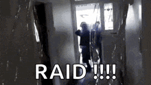 a person standing in a hallway with the word raid written on the bottom