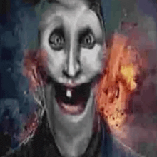 a man with a tooth in his mouth is smiling in front of a fire explosion .