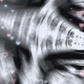 a blurry picture of a person 's face with hearts and music notes in the background