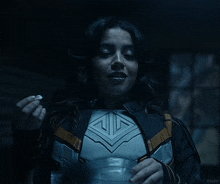 a woman in a superhero costume is eating something out of a bowl .