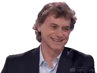 a man in a suit and white shirt is smiling with the words made with unscreen below him
